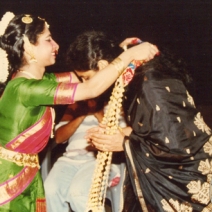 Sarayu Sai garlanding her Guru Smt Chitra Visweswaran